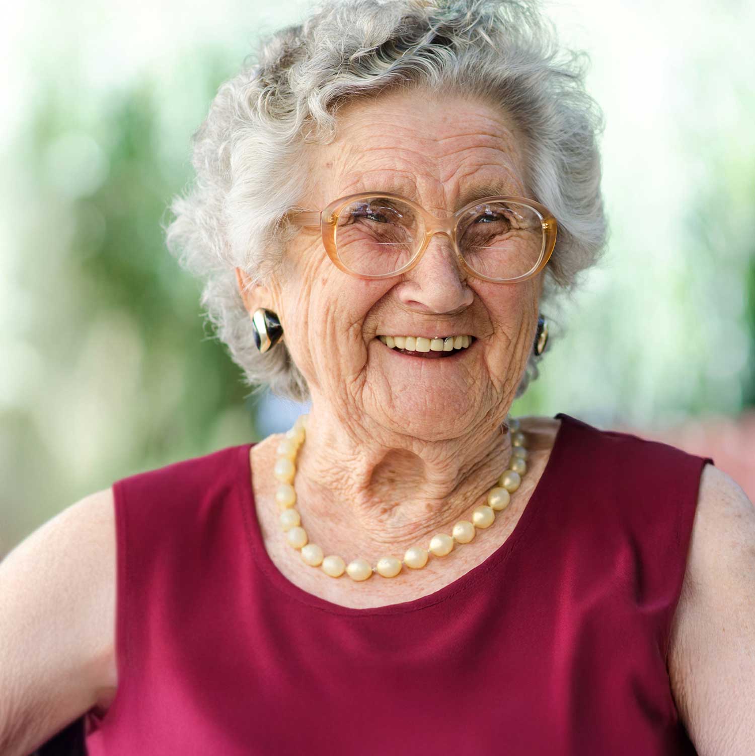 an elderly woman with a big smile